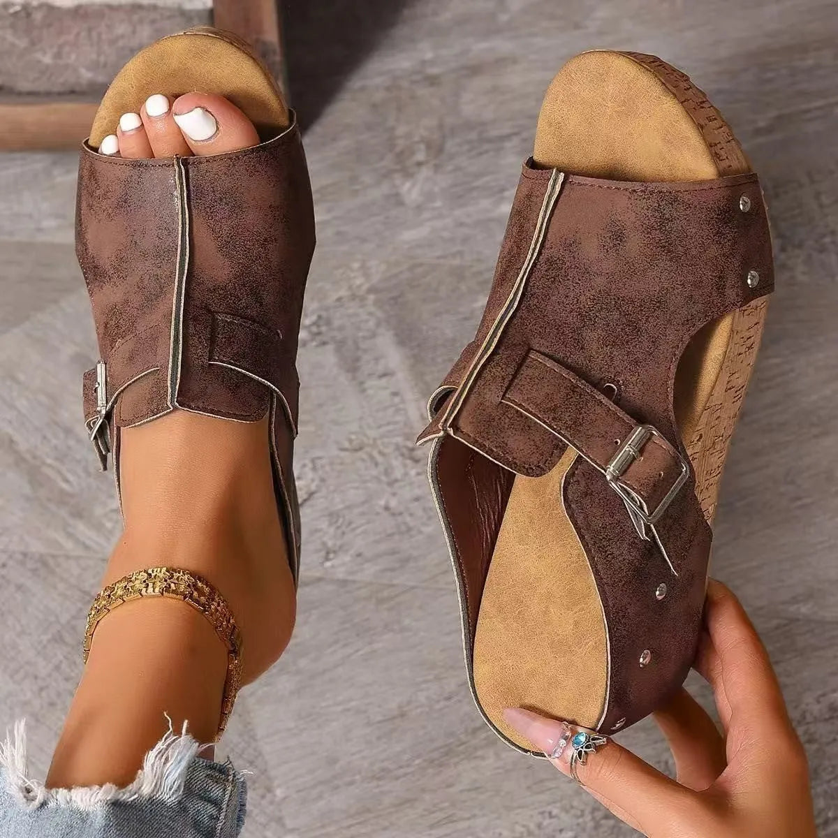 Plus size wedge sandals with rivet detailing, fish mouth open toe, PU upper, and rubber sole in black colour option.