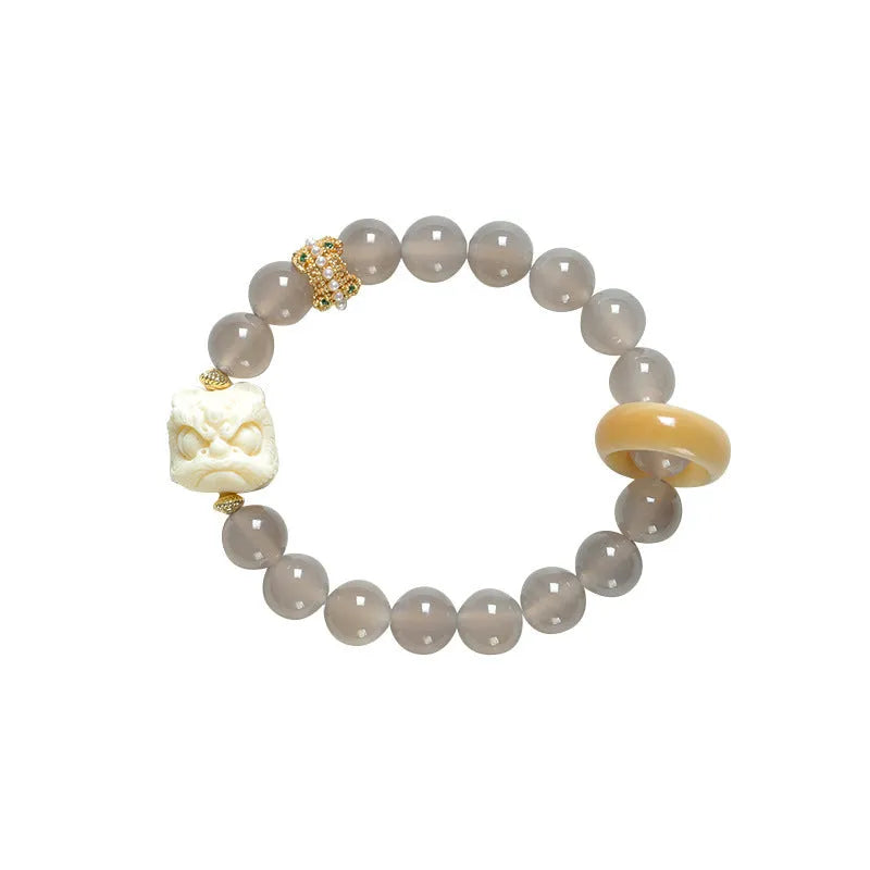 Grey agate melilite bracelet with 10mm round beads and hand-woven construction