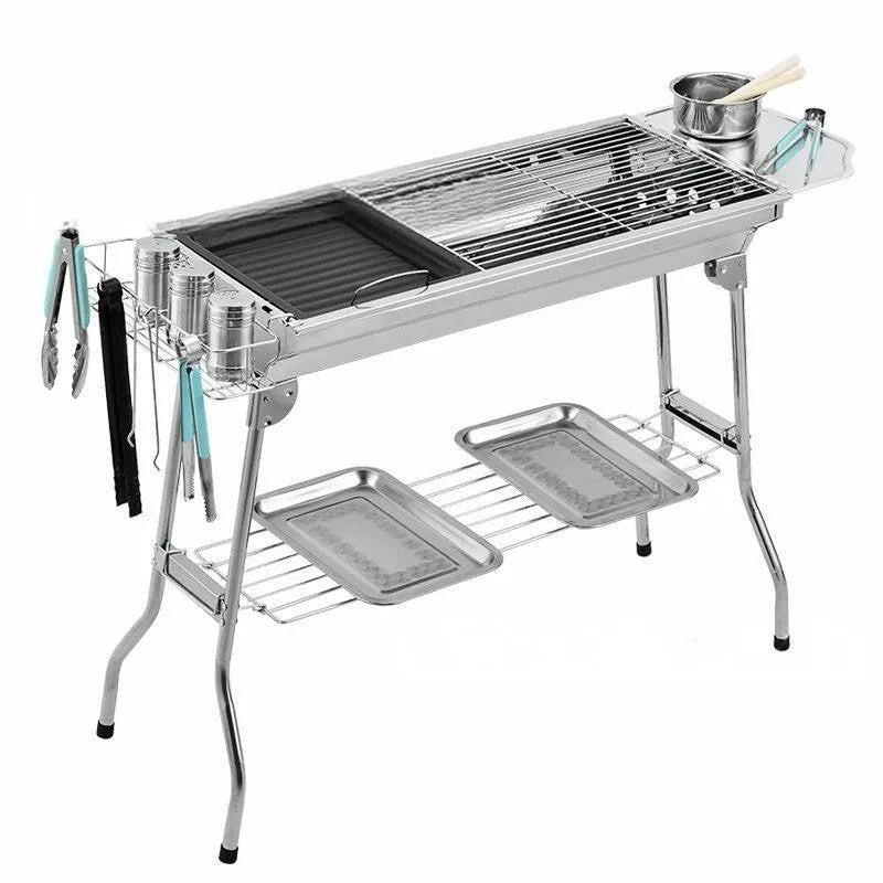 A stainless steel portable folding barbecue oven with dimensions 73cm long, 33.5cm wide, and 70cm high.