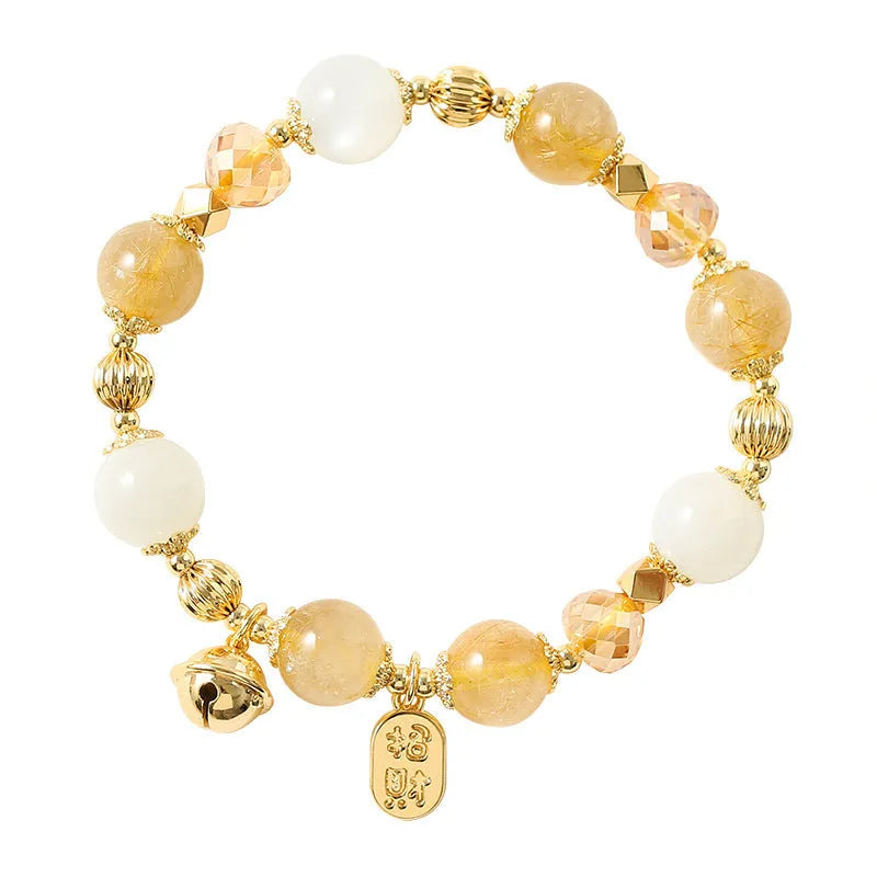 Gold electroplated adjustable chain bracelet with a rutilated quartz crystal in Lucky Fortune colour.