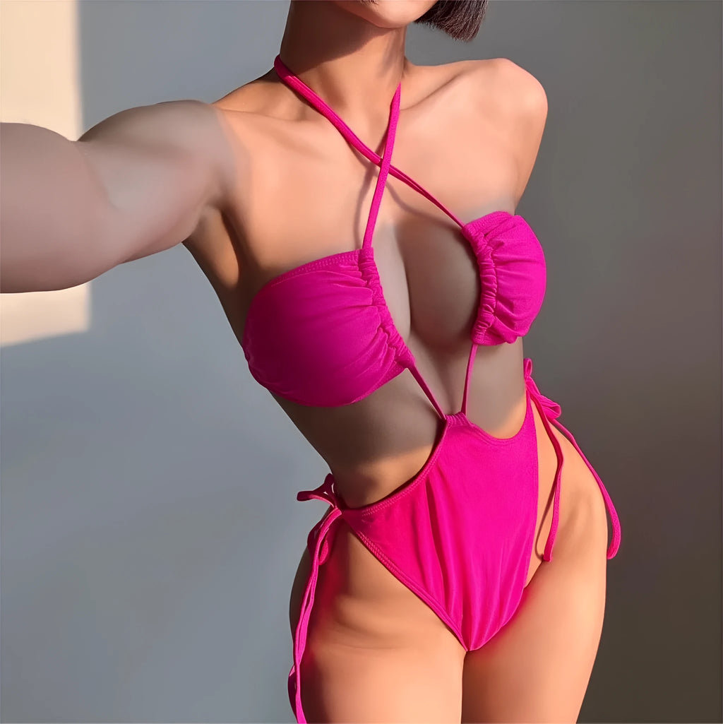 Women's black drawstring one-piece swimsuit on a hanger, showing briefs style cut.