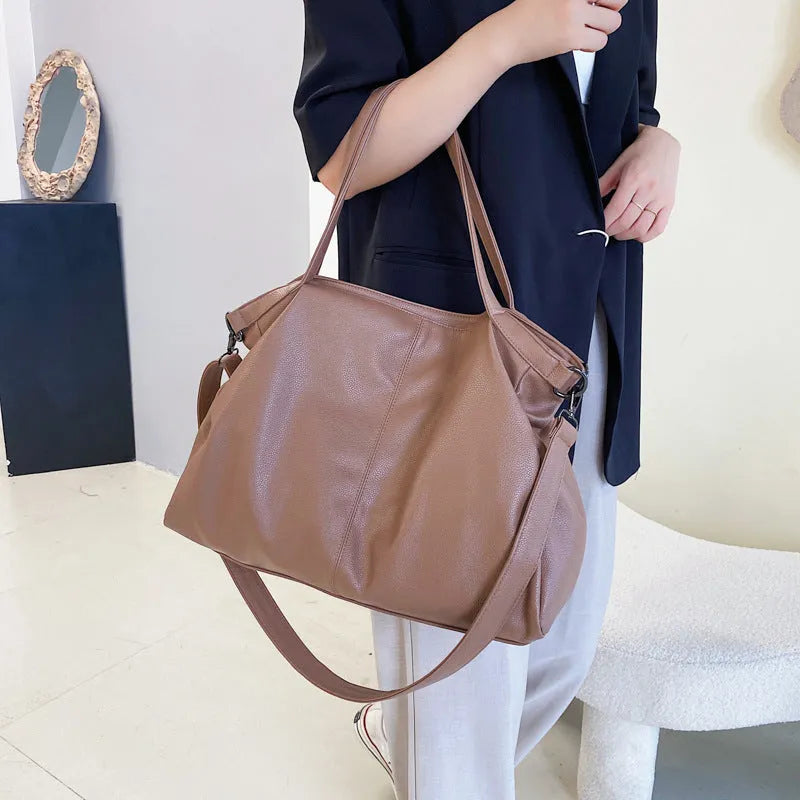 Large soft-surface PU messenger tote bag in a choice of colours, showing internal pockets and adjustable shoulder strap.