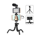 Black octopus-style flexible tripod kit with attached fill light and microphone for live broadcasting.