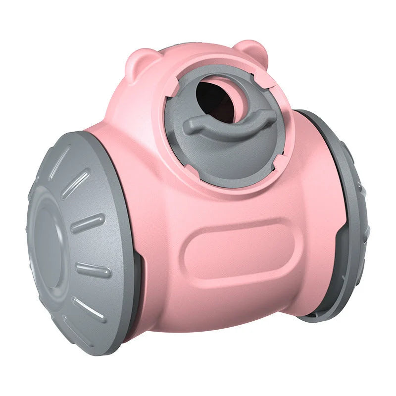 Interactive dog tumbler toy in red, green, and pink for IQ enhancement and slow feeding