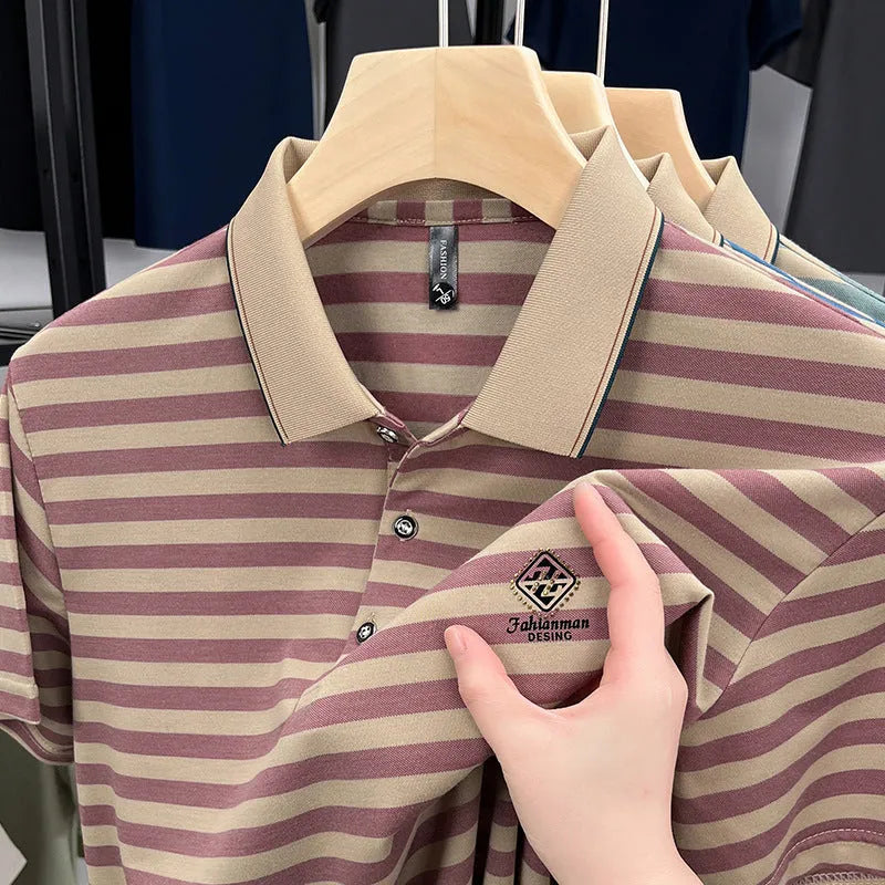A man wearing a red, blue, or green striped short sleeve casual shirt with a mosaic pattern detail.