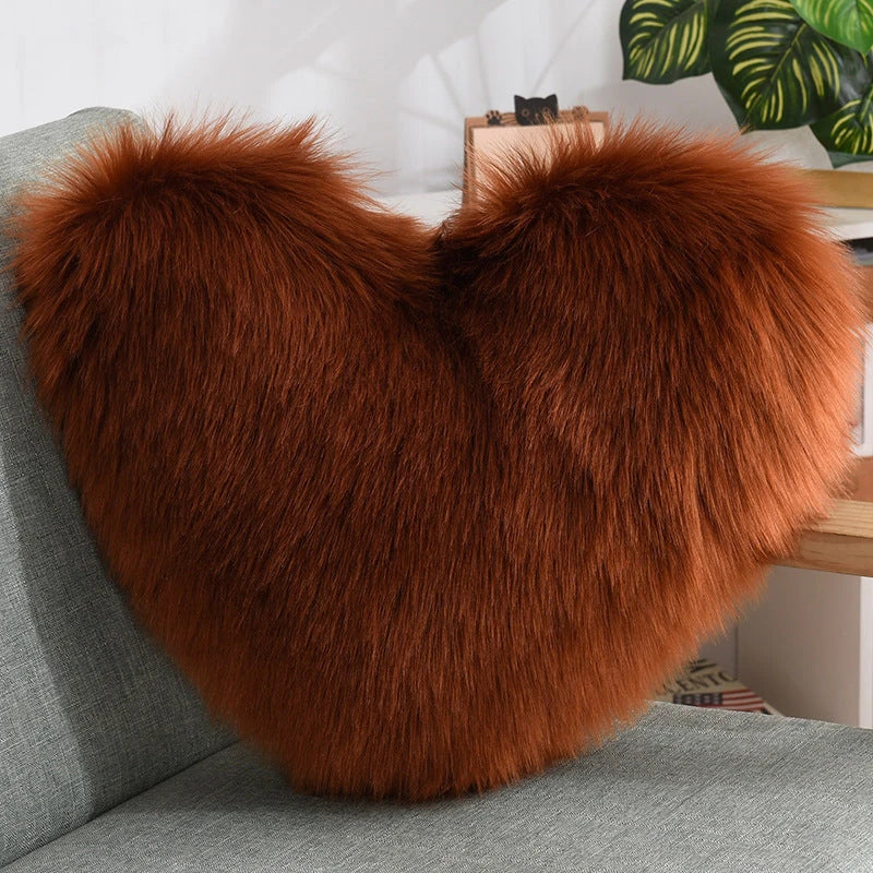 Plush heart-shaped throw pillows in various colors and styles for cozy sofa decor