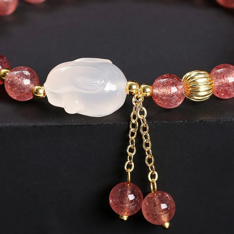 Women's strawberry quartz agate bracelet with 6mm geometric beads and White Rabbit design
