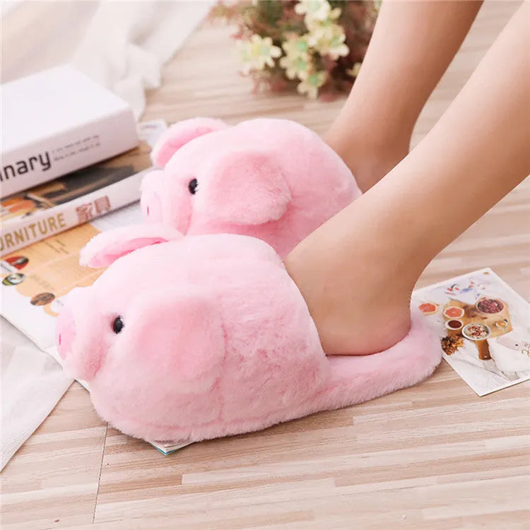 Pink pig-themed floor slippers with short plush exterior.