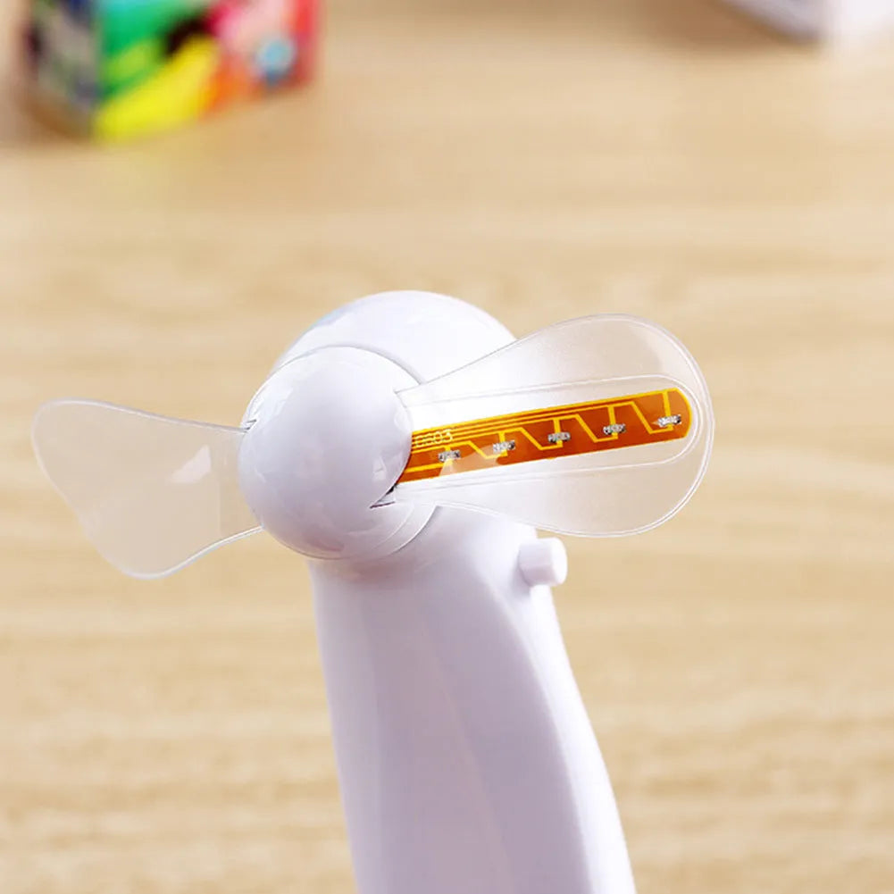 White handheld mini fan with a flashing LED love pattern display.