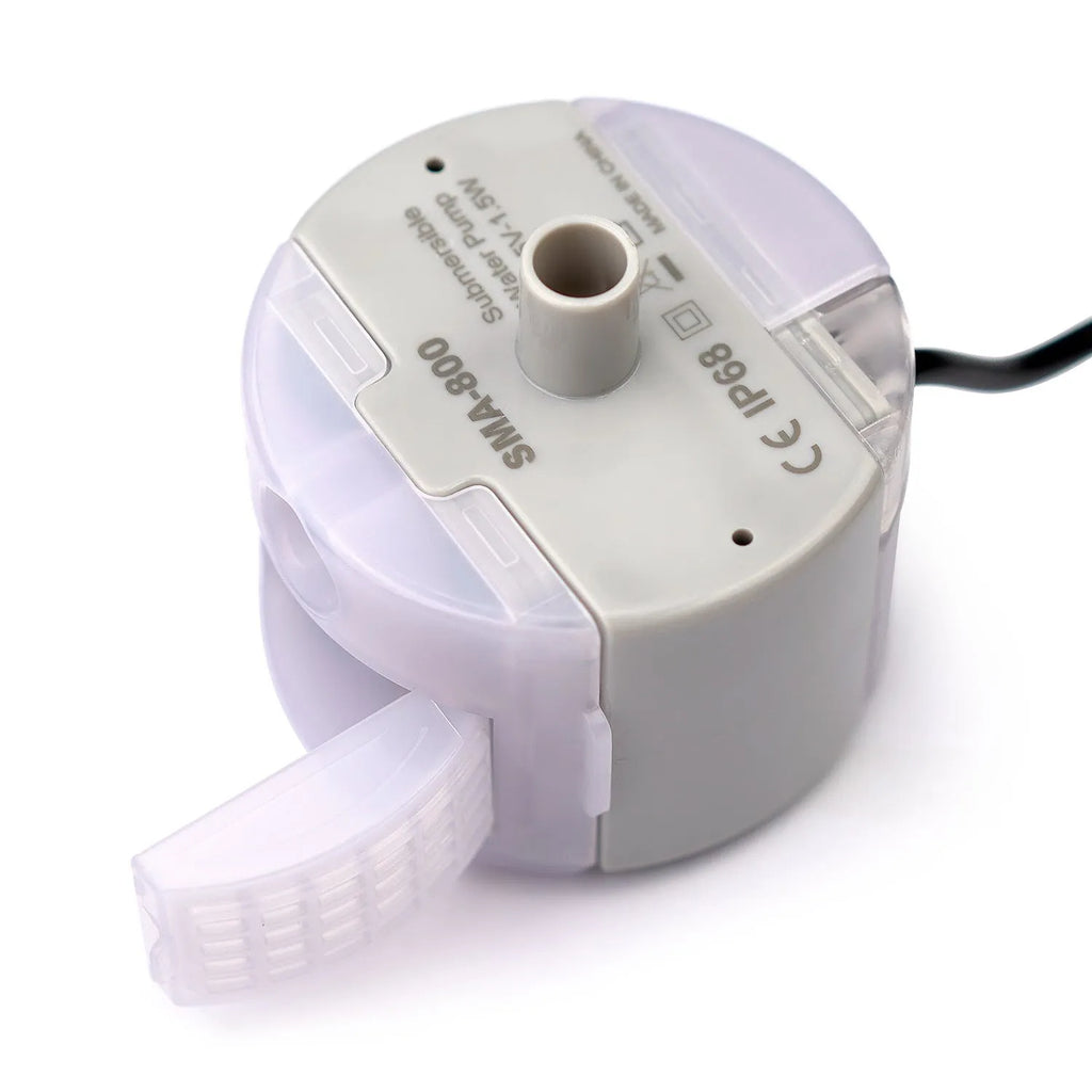 Cylindrical plastic pet water pump with three cleaning brushes on a white background
