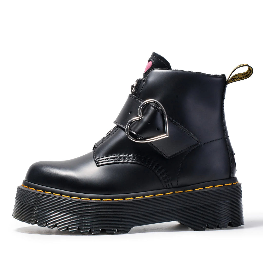 Women's black leather ankle boots with chunky heel, lace-up front, side zip, and belt buckle detail on a waterproof platform