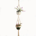 Natural jute cotton rope woven macramé plant hanger in a layered design for wall or ceiling hanging.