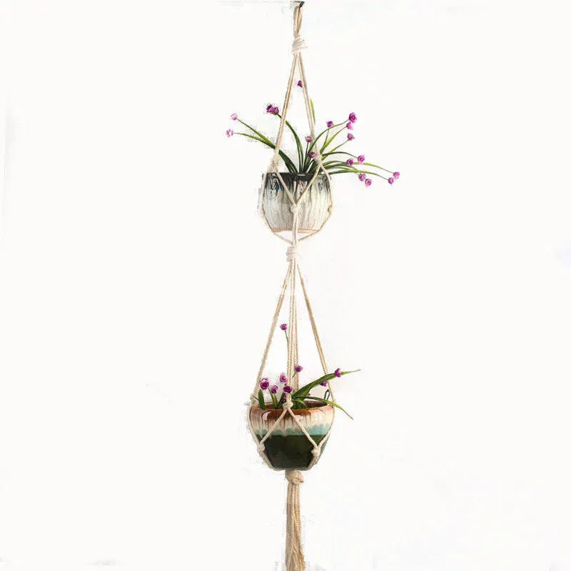 Natural jute cotton rope woven macramé plant hanger in a layered design for wall or ceiling hanging.