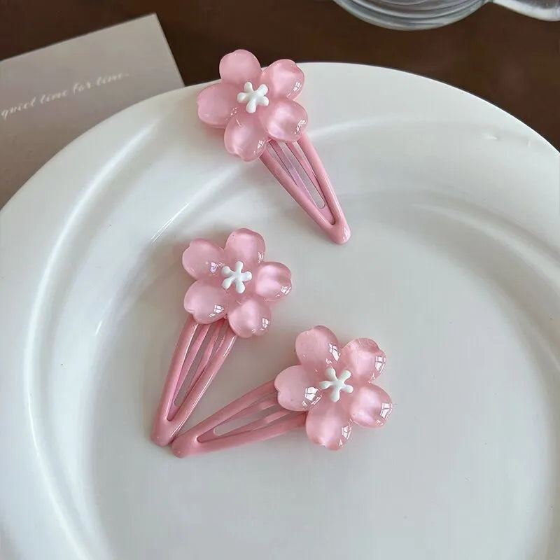 Handmade acrylic cherry blossom hair clip in pink floral design for women