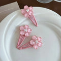 Handmade acrylic cherry blossom hair clip in pink floral design for women