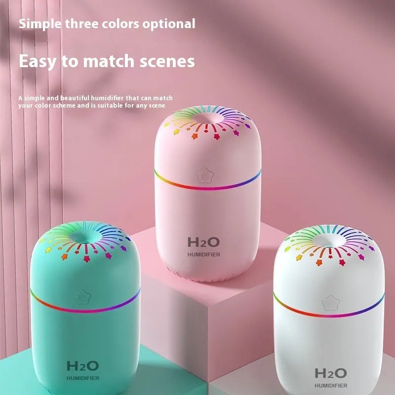 Compact white USB humidifier with 300ml tank beside laptop showing dimensions