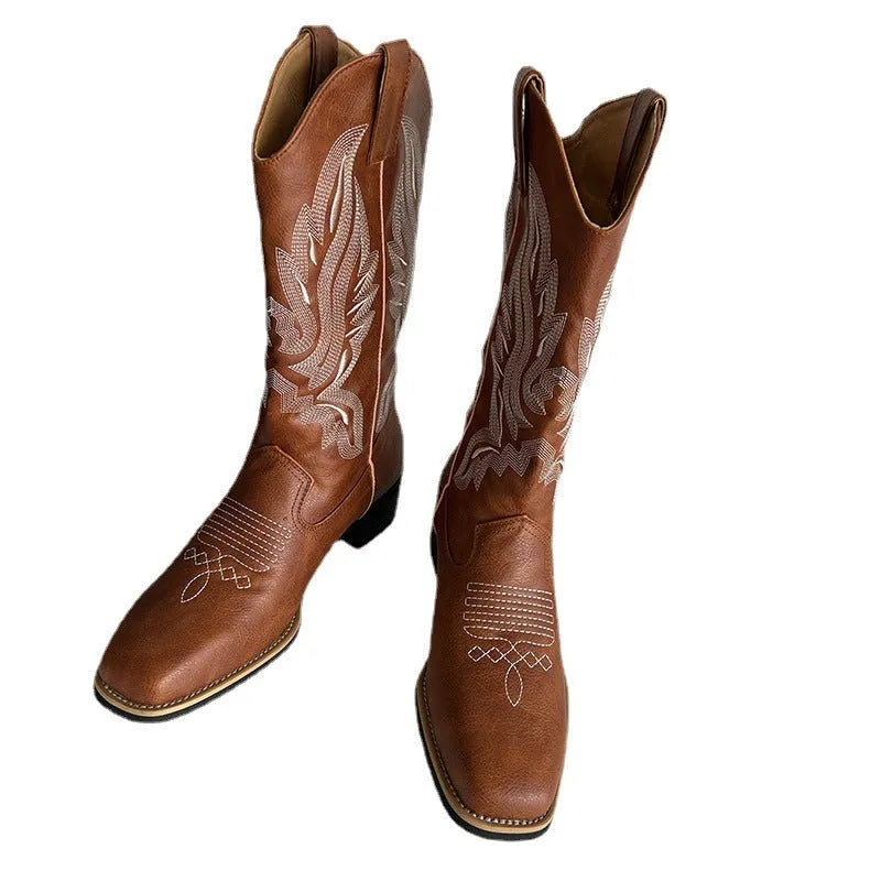 Brown leather women's mid-calf Martin boots with embroidered totem pattern and a waterproof platform sole.