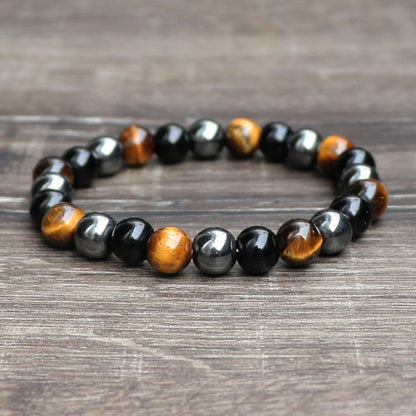 Hand-woven tiger eye stone bracelet in natural colours, showcasing unique texture and geometric design.