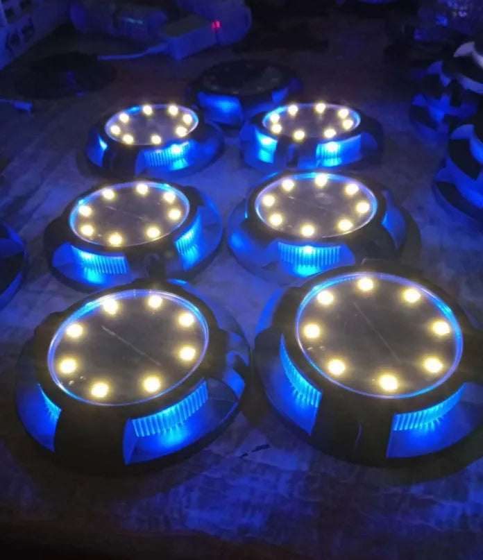 LED solar underground lawn light 11x4x13cm black ABS PP with seven colour changing cold white light on grass at dusk