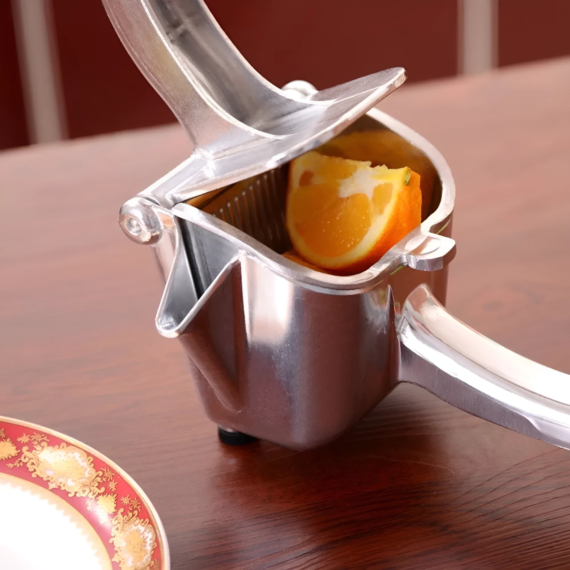 Silver heavy duty aluminium alloy lemon squeezer with large bowl on countertop