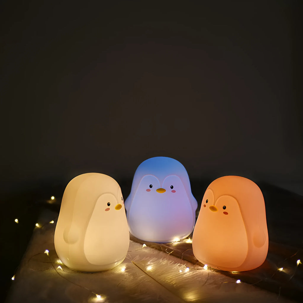 White silicone and ABS penguin-shaped rechargeable night light with USB cable