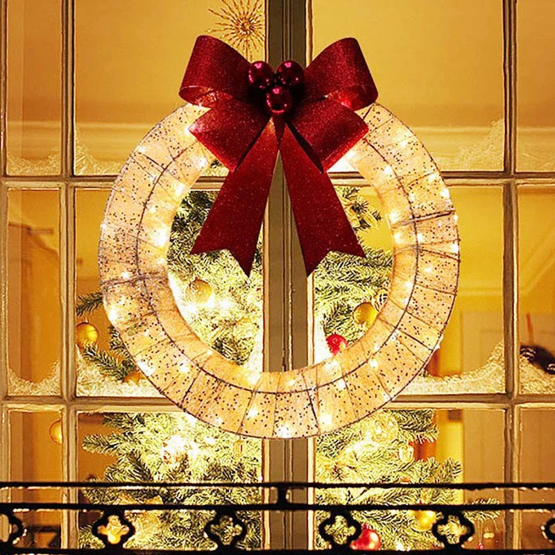 Festive 20-inch luminous LED Christmas wreath with gold and green tinsel garland and large bow