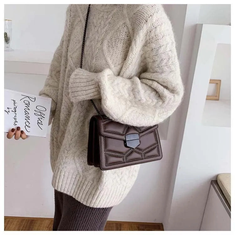 Small square shoulder bag with studs, chain handle, black colour, flat lay view