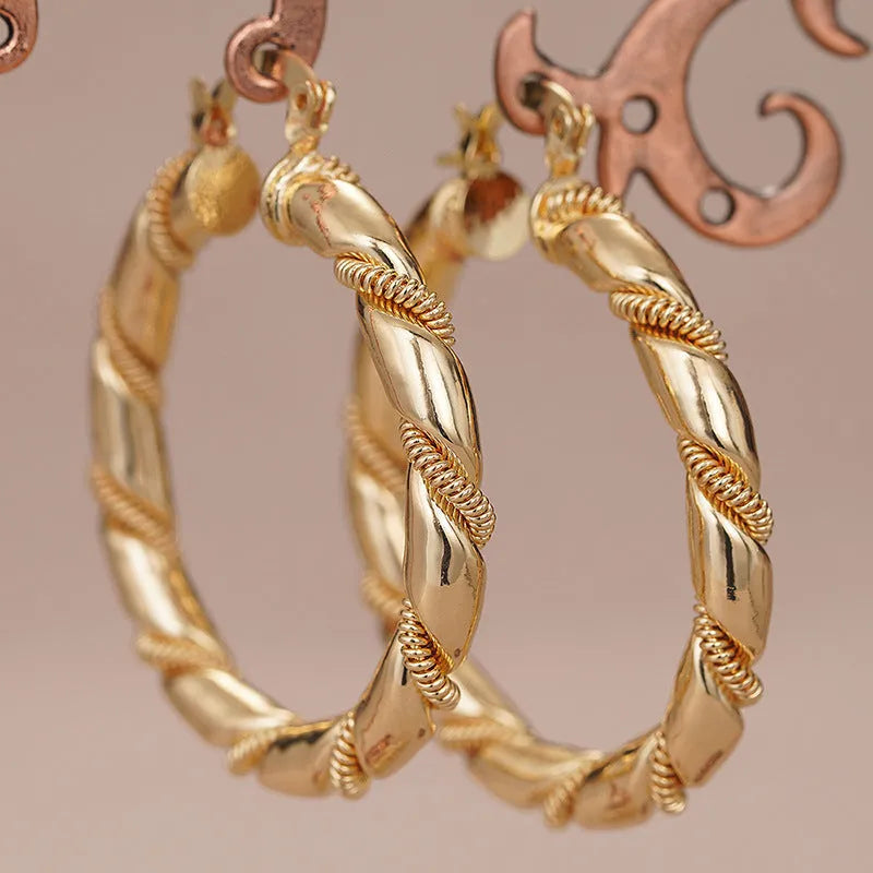 Geometric copper ring ear clip for women in a golden colour.