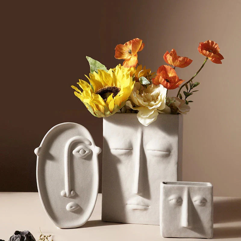 Stylish ceramic face vase with unique human-inspired designs, perfect for adding a touch of Kiwi charm to any living space