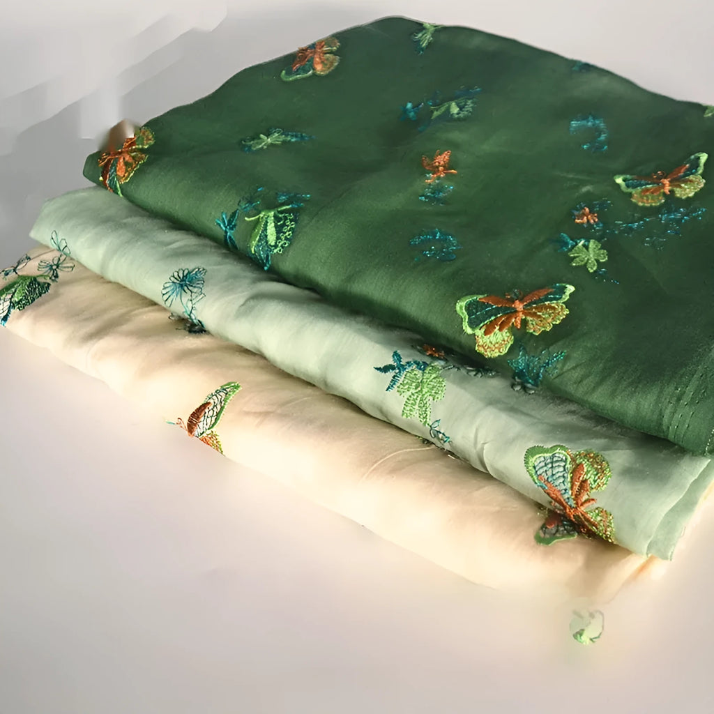 Pure ramie embroidery cloth fabric for hanfu, shown in beige, grass green, and dark green colours.