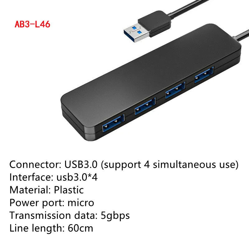 Black USB 3.0 hub with four ports, indicator lights, and a 30cm connecting cable on a desk.