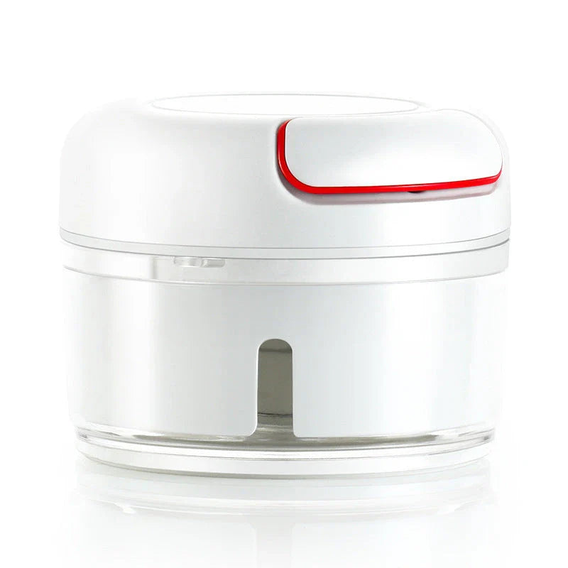 Manual cutting meat grinder with stainless steel blades on a kitchen counter