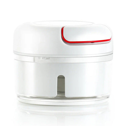 Manual cutting meat grinder with stainless steel blades on a kitchen counter