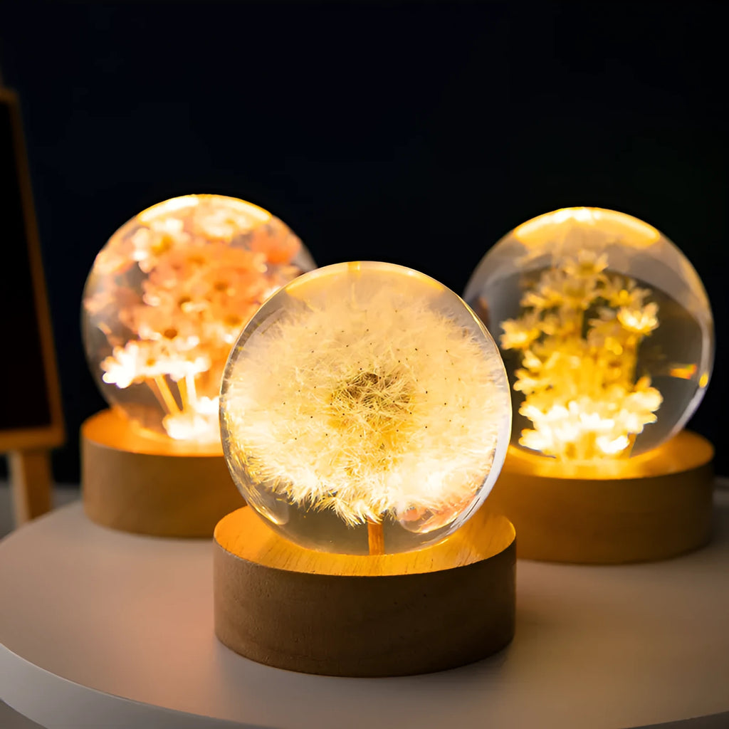 3D dandelion crystal ball desk lamp on beech wood stand, serving as a USB night light.