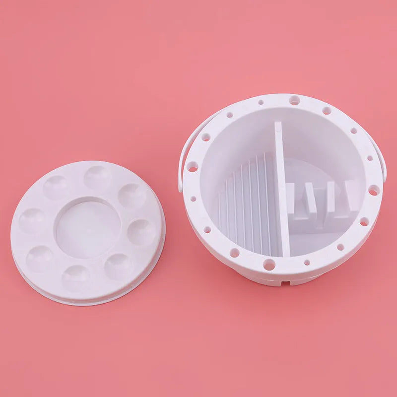 White plastic portable brush holder for painting, shown with approximate 16.5 cm diameter.