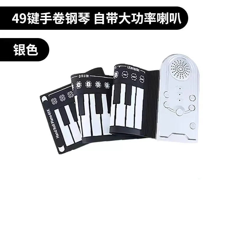 Compact folding electronic keyboard with 49 black silicone keys, shown in gloss black finish, rolled for storage next to its control panel.