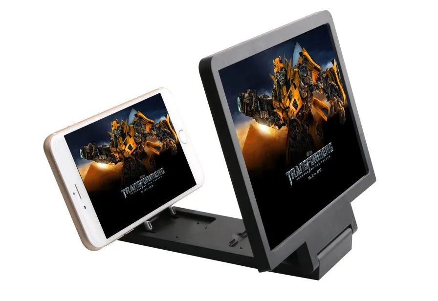 Black and white foldable screen amplifier lens for mobile phones, shown next to a smartphone for scale.