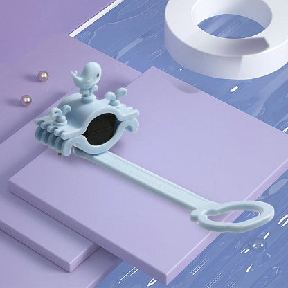 Children's faucet extender in blue, pink, and purple colours