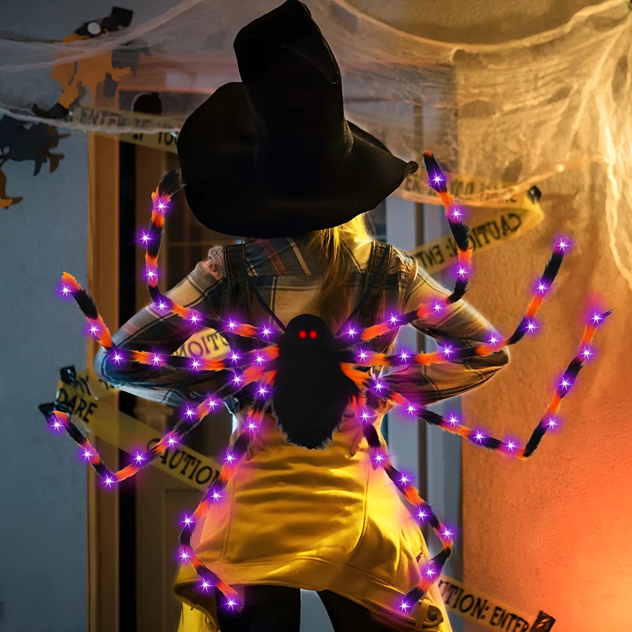 Plush Halloween spider backpack with LED lights in a green purple light colour variant.