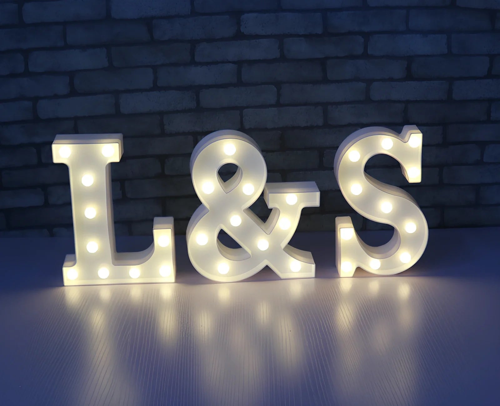 White plastic LED alphabet marquee sign with warm white illumination, 22cm height with battery operation