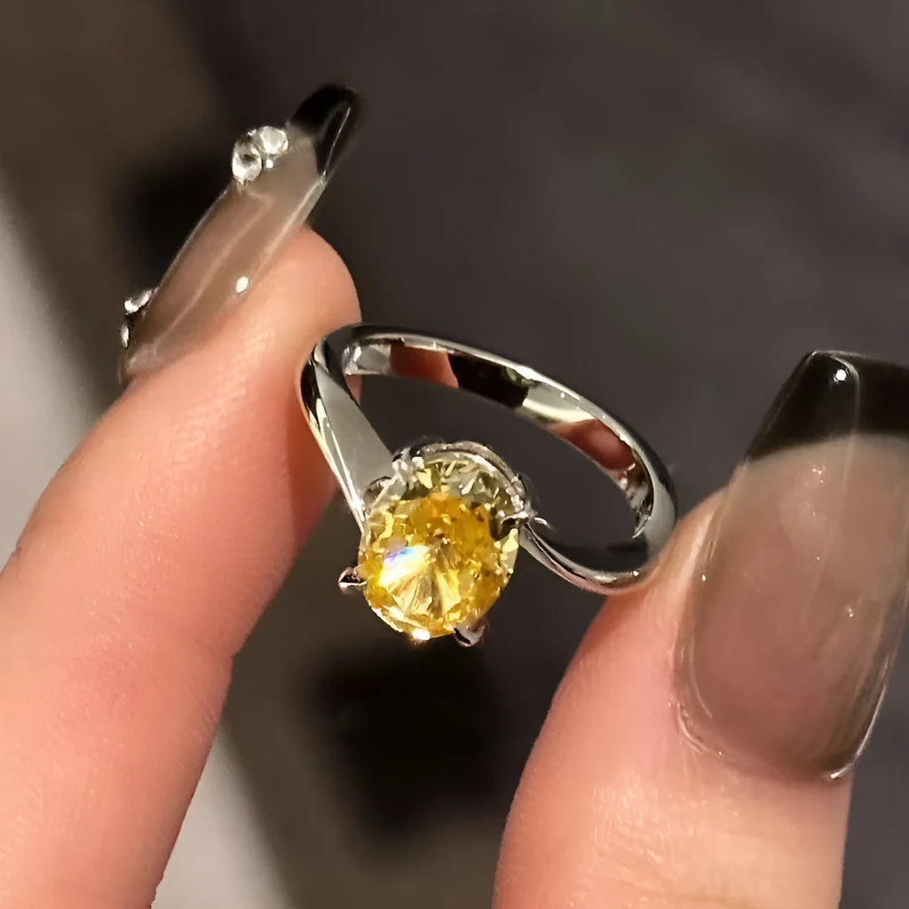 Yellow rock sugar crystal colour copper ring for women on a ring stand.