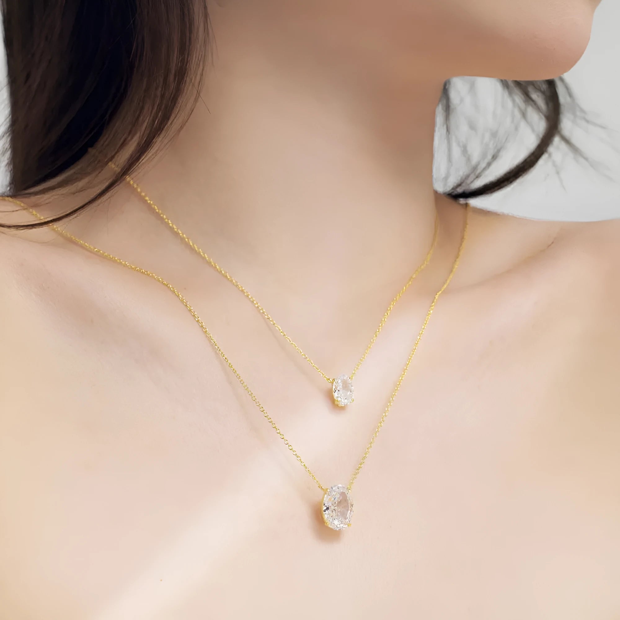 S925 sterling silver necklace with an oval ice flower geometry pendant in gold or platinum finish.