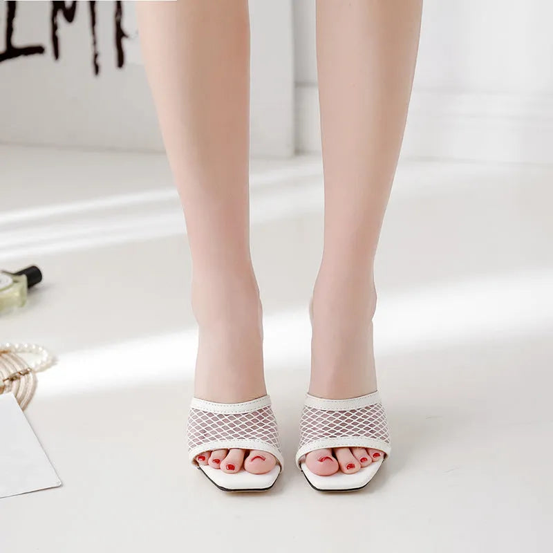 Women's white fish mouth sandals with leather insole and side air detail, side view