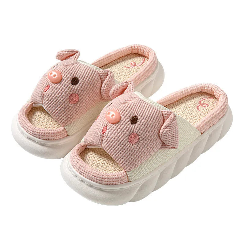 A pair of open toe linen slippers for couples on a light background, showing the flip-flop style and linen upper texture.