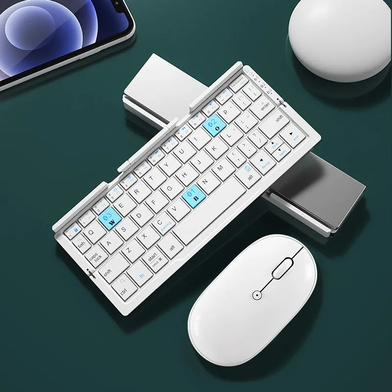 Silver white folding Bluetooth keyboard with integrated stand holding tablet at angle