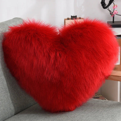 Plush heart-shaped throw pillows in various colors and styles for cozy sofa decor