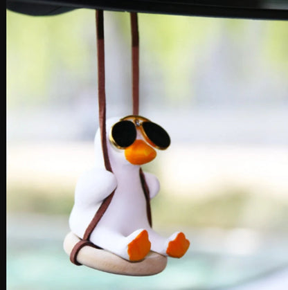 Gypsum duck ornament with swing tire design measuring 6x5x6cm for decorative displays