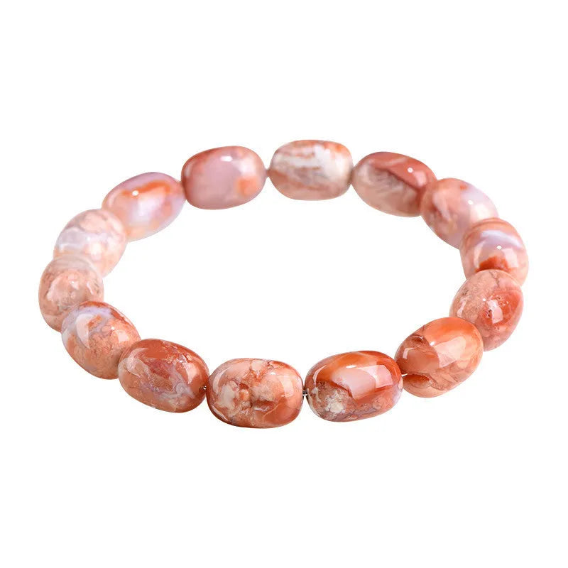 Natural cherry agate barrel bead bracelet with Ruyi charm on a white background.