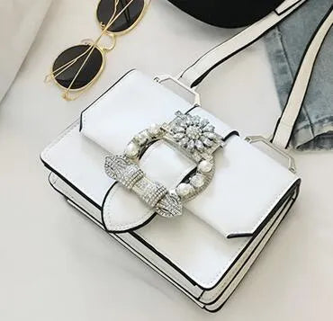 Women's designer diamond lock shoulder bag in quality PU leather, available in Black and Blanco colour options