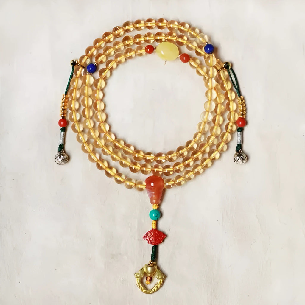Yellow natural Brazilian citrine bracelet with 1mm beads and filament details on a wrist.